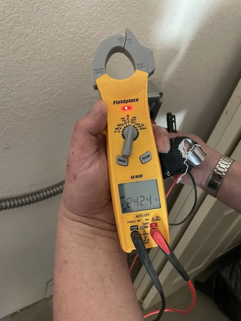 Voltage testing with clamp meter during Generator Installation in Muskegon Heights